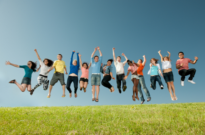 A group of young people jumping in the air